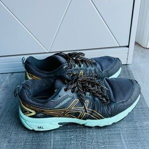 ASICS Black Running Shoes with Teal Soles and Orange Accents